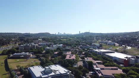 bedfordview, johannesburg - beautiful drone establishing rise plus zoom shot of the city of johannesburg on a bright sunny day in gauteng, south africa