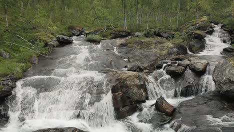 Smooth-pull-out-shot-of-beautiful-waterfall-in-northern-Norway