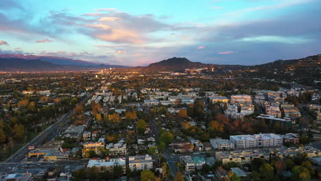 Homes-in-the-San-Fernado-valley,-vibrant-evening-in-Los-Angeles---Aerial-view