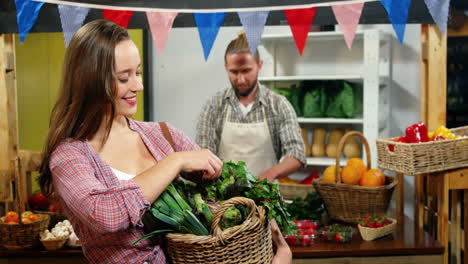 portrait of happy woman buying leaf vegetables