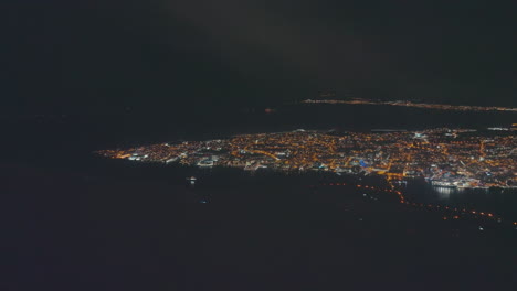 aerial view of a city at night with light pollution