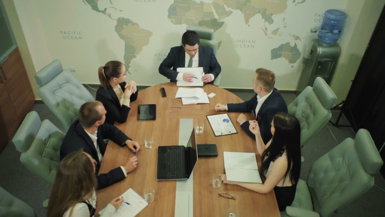 Office Workers In Business Training. Team of business professionals are having a meeting