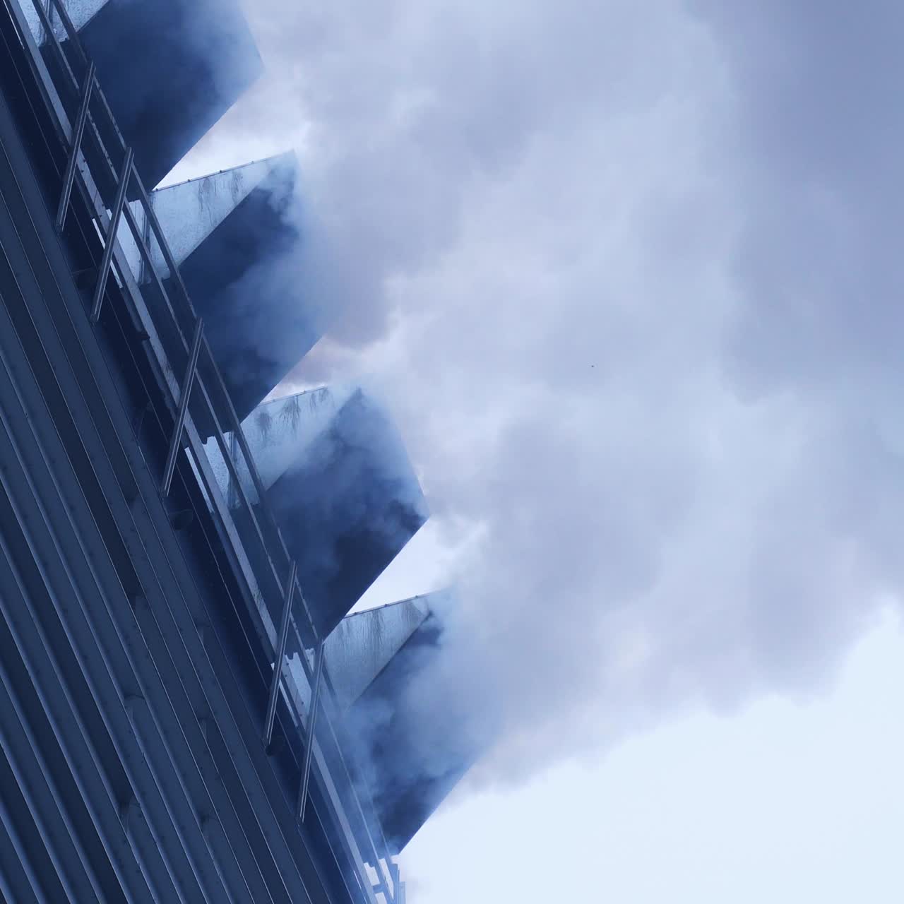Elevator heating system smoking. White puffs of smoke from a modern heating stove