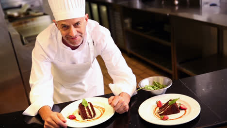 Chef-putting-mint-leaves-onto-chocolate-cake