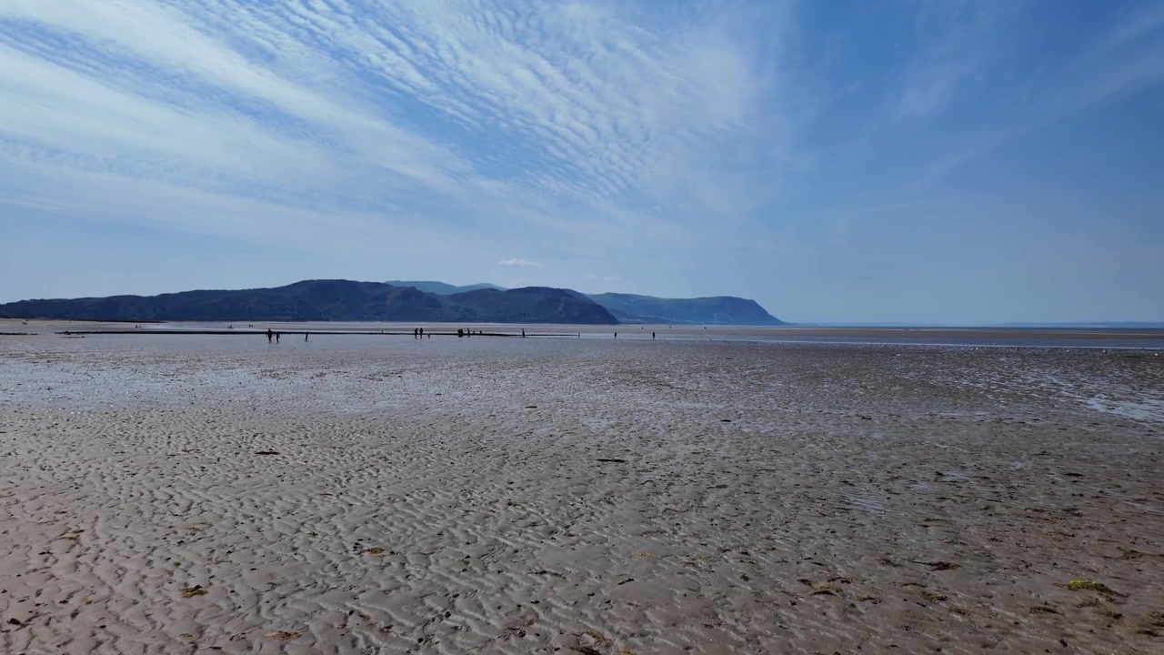 Spiaggia di West Shore a Llandudno, Galles, bassa marea, Mare d'Irlanda, Regno Unito, estate.