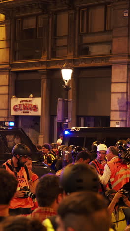 barcelona - spain - october 18 2019 : riot police clash with protestors at the general strike in via laietana, barcelona in vertical