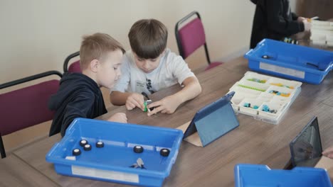 happy smiling boys having fun in workshop