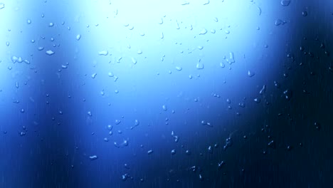 gota de agua en fondo de video azul