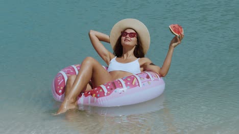 woman in the sea on a rubber ring