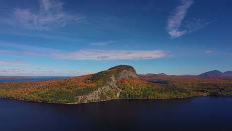 aerial orbit high above a distant kineo mountain in peak autumn foliage