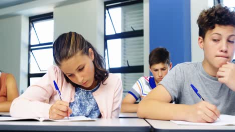 Schoolboy-cheating-during-exam-in-classroom