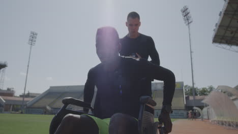 athlete in wheelchair training with support