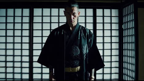 a serious japanese man in kimono