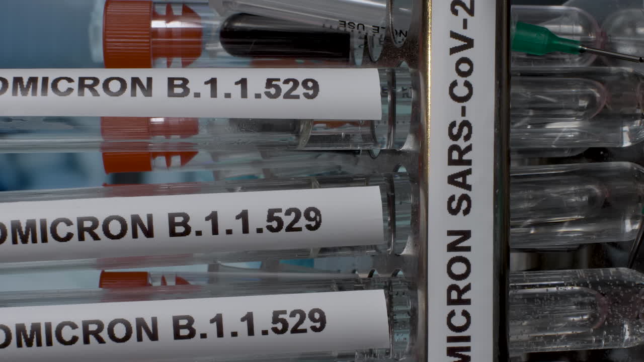 Close up vertical dolly shot of Omicron B.1.1.529 laboratory samples being placed into a rack, the new deadly variant of Covid 19 identified in South Africa