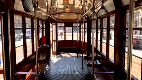 interior of a typical historic milan tram with wooden interiors 2. 4k quality