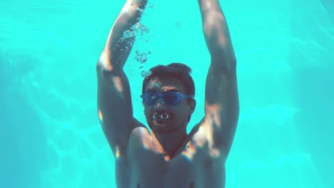 handsome man stretching underwater