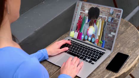 Caucasian-woman-having-a-video-call-with-female-colleague-on-laptop