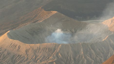 smoke rose from bromo crater the steaming active volcano, tengger semeru national park in east java, indonesia