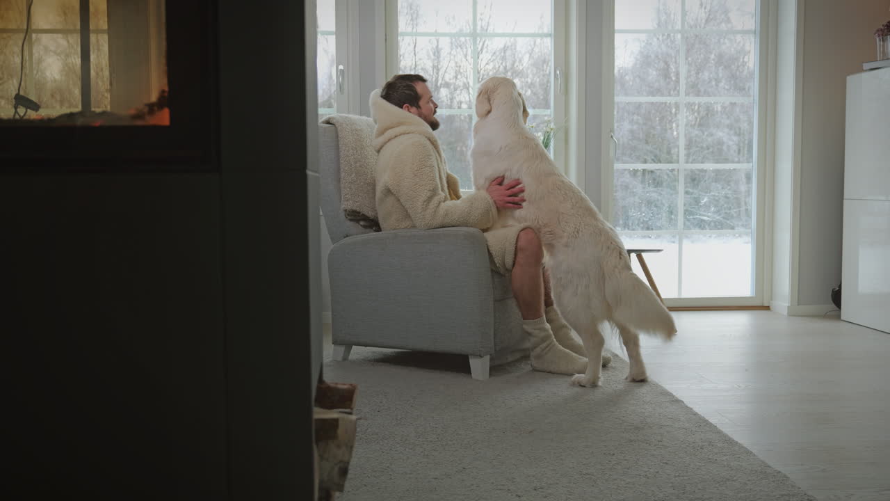 Man Interacting with His Joyful Dog at Cozy Home