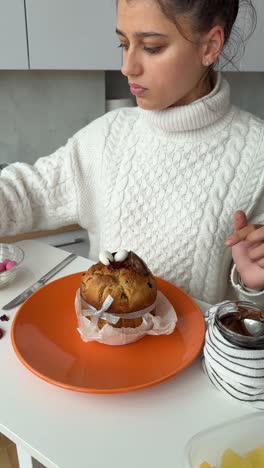 child decorating easter bread