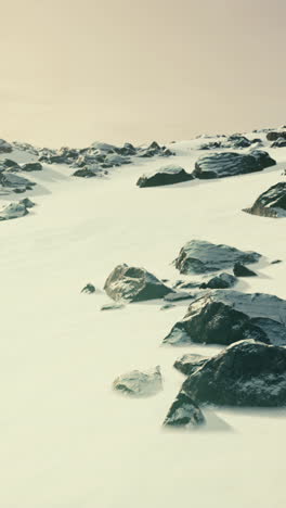 snowy landscape with rocks