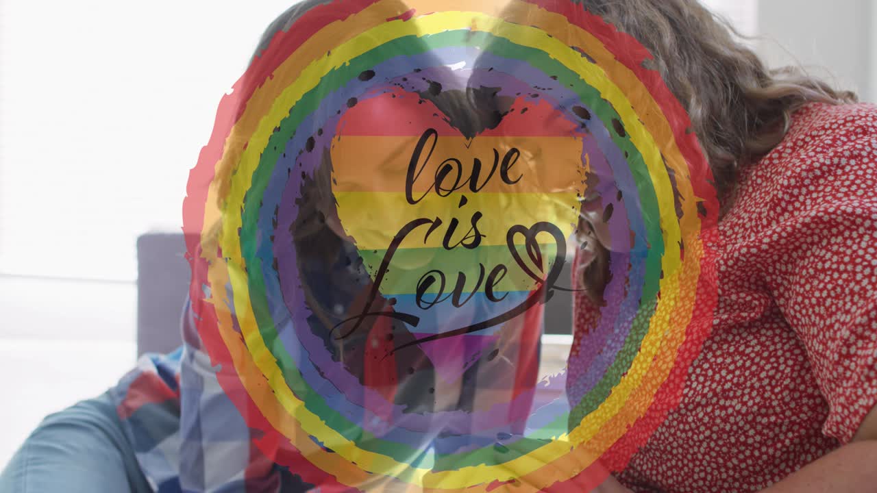 Animation of rainbow circle and love is love over lesbian couple petting dog