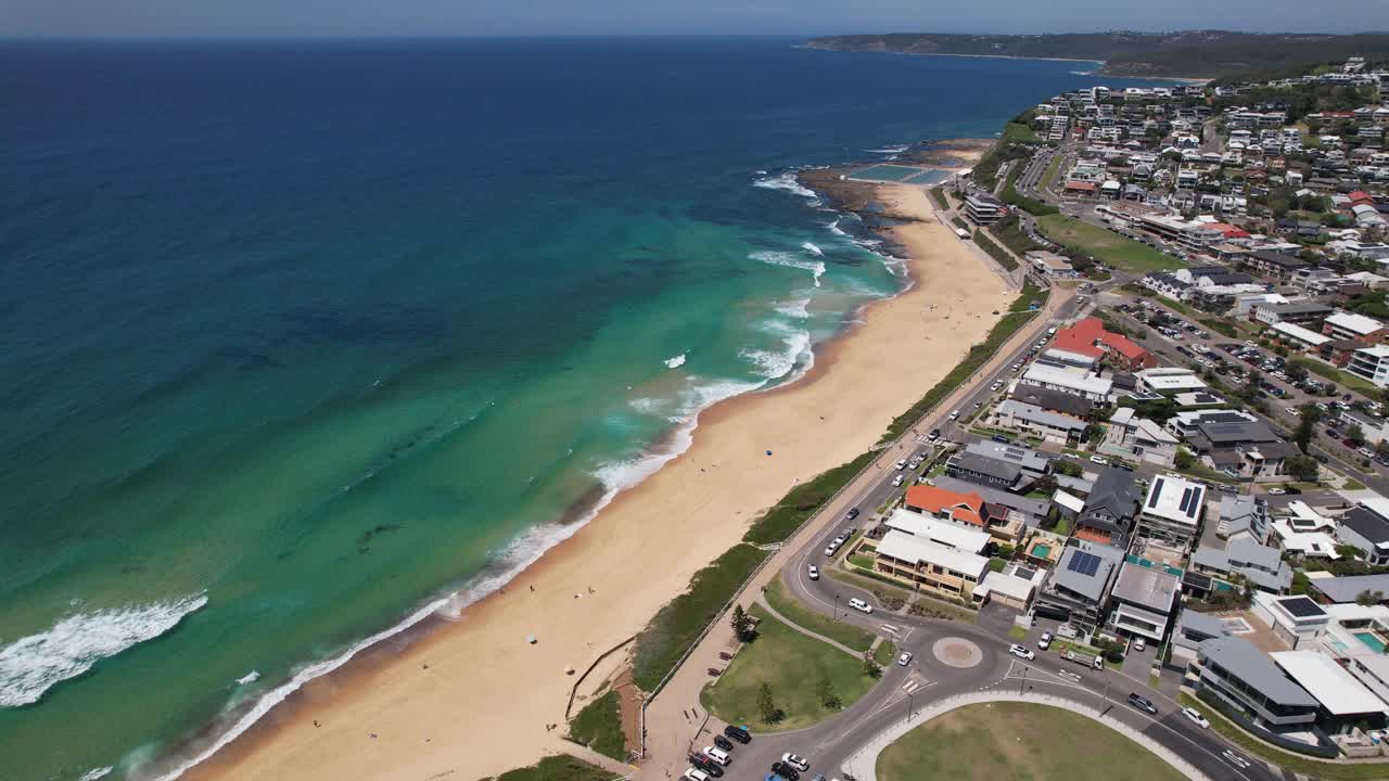 Merewether Beach With Luxury Beachfront Homes In Newcastle, NSW, Australia. aerial arc shot