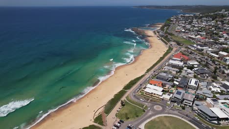 merewether beach with luxury beachfront homes in newcastle, nsw, australia. aerial arc shot