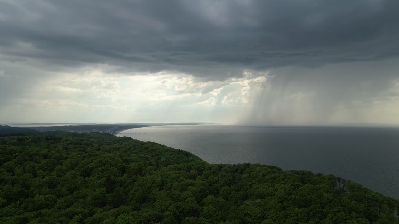 Dramatic Sky And Heavy Rain Dropping At Baltic Sea Nearby Swinoujscie In Poland. aerial, wide shot