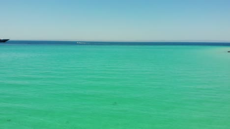 Flying-over-the-turquoise-and-crystal-clear-waters-of-Balandra,-near-La-Paz-in-BCS,-Mexico