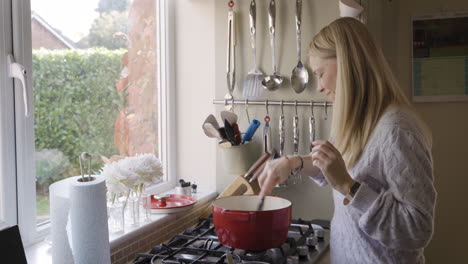 woman cooking in kitchen
