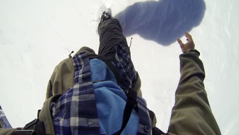 pov gopro view of walking on snow with difficulty at swiss alps