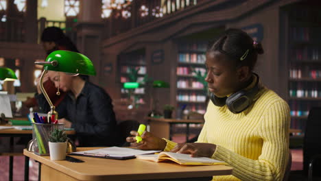 teenager studying in library