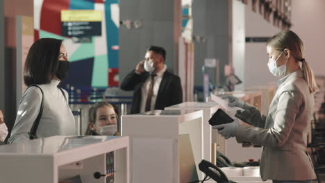 Mother With Kids At Check-In Counter