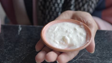 woman eating yogurt