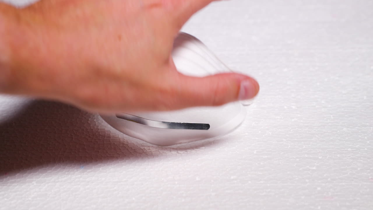 Men's Hand Lifting Protective White Mask Mask Against Threats Like Corona Covid19 Virus Protects Mouth and Nose from Dark Black Board capture in 4k 60fps