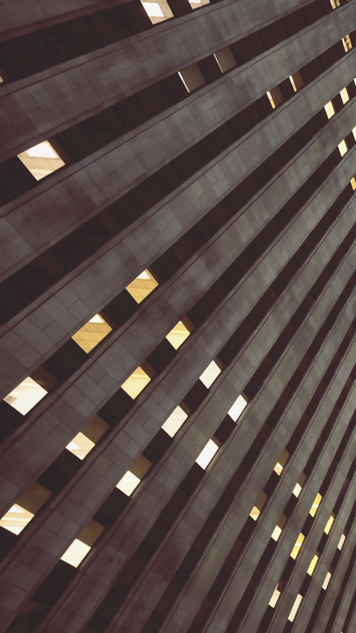 Creative patterns and lights play on modern architecture at dusk