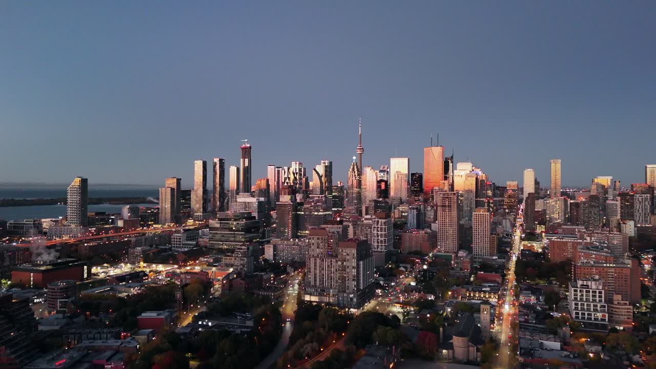 This 4k drone shot shows the drone elevating showing downtown Toronto Canada on a early autumn morning