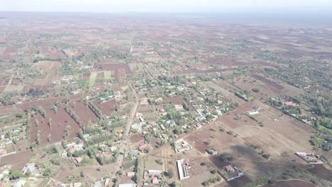 aerial panoramic view of rural village area and crop field of kenya