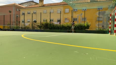 slow motion of a tennis player hitting forehand the ball during a tennis game in portugal, lisbon