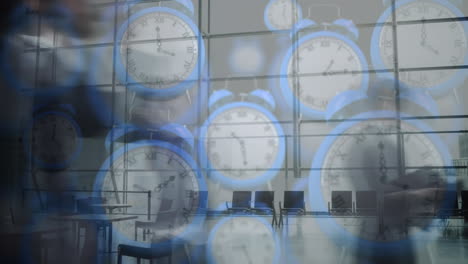animation of blue digital clocks over time-lapse of people walking in office