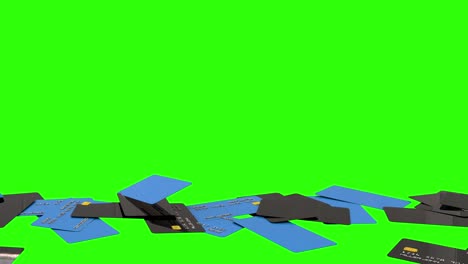 las tarjetas de débito y crédito caen apiladas en el suelo sobre un fondo de pantalla verde. representación del consumismo, la deuda, las finanzas del hogar, las compras en línea, el comercio minorista, la riqueza, etc. animación 3d