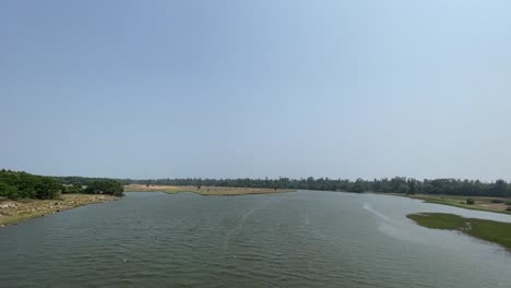 river entering the sea near puri sea beach in orissa