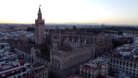 Iconic-Roman-Catholic-Seville-Cathedral-at-sunset,-Spain