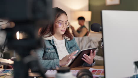 woman working on computer with microphone and tablet