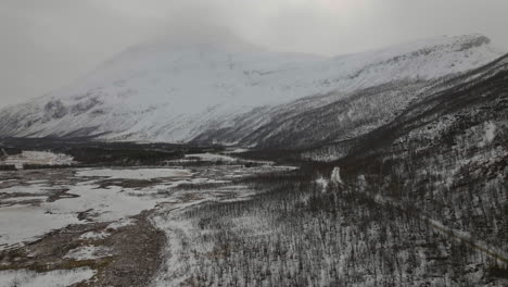 Snowy-Mountain-Scenery-Of-Signaldalen-In-Northern-Norway-In-Winter---aerial-shot