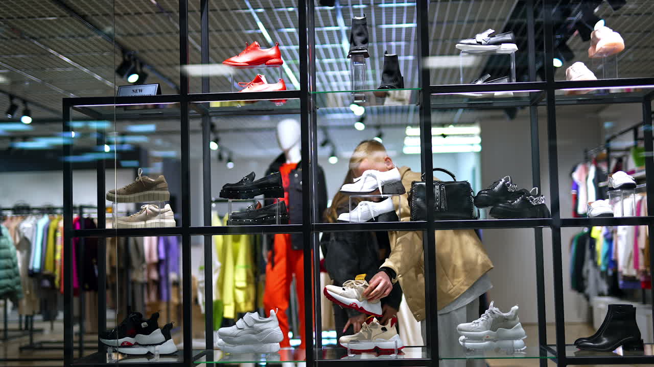 Couple Shopping for Shoes in a Modern Fashion Store