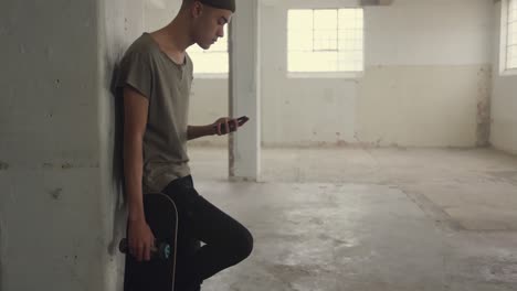 fashionable young man in an abandoned warehouse