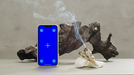 Person holding Palo Santo wood stick in hand, aromatic Palo Santo burning on black background, smoke spreading around, slow motion video clip, high quality 4k close up footage. High quality 4k footage