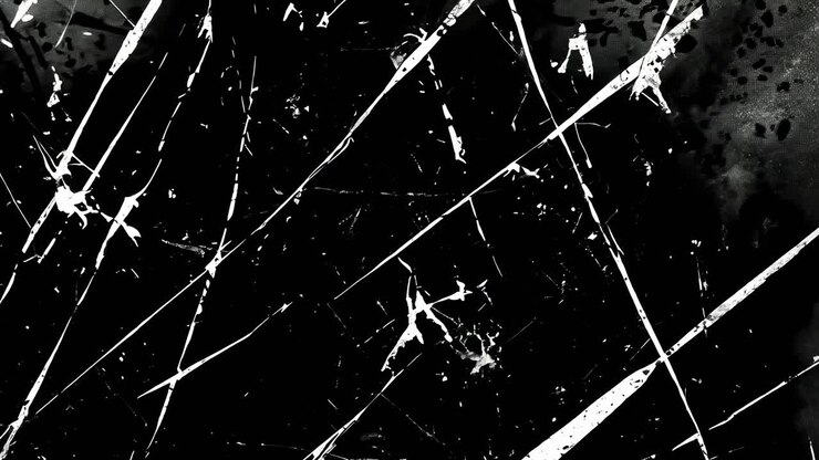Fotogramma astratto di un video con un angolo ravvicinato, che mostra superfici scure e strutturate e intersecanti
